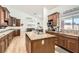 Spacious kitchen has wood cabinets, granite countertops, and is open to the living spaces at 8515 Belcastro St, Las Vegas, NV 89113