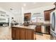 Modern kitchen with stainless steel appliances and a center island at 8515 Belcastro St, Las Vegas, NV 89113