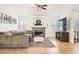 Cozy living room features a fireplace, large windows, and comfortable seating area at 8515 Belcastro St, Las Vegas, NV 89113