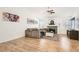 Inviting living room with a comfortable couch, fireplace, ceiling fan, and natural light at 8515 Belcastro St, Las Vegas, NV 89113