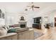 Cozy living room showcasing a fireplace, TV, and dining area in a bright space at 8515 Belcastro St, Las Vegas, NV 89113