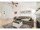 Spacious living room featuring a grey sofa, light wood floors and decor at 8515 Belcastro St, Las Vegas, NV 89113
