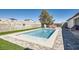 Beautiful pool with lush landscaping in a private backyard at 8515 Belcastro St, Las Vegas, NV 89113