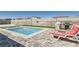 Relaxing pool area with lounge chairs and a grill at 8515 Belcastro St, Las Vegas, NV 89113
