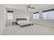 Serene bedroom with ceiling fan, neutral color scheme, and ample natural light at 8564 Scalpay St, Las Vegas, NV 89166