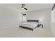 Bright bedroom with neutral color scheme, ceiling fan and large windows at 8564 Scalpay St, Las Vegas, NV 89166