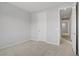 Spacious bedroom with neutral carpet and an open doorway to the hallway at 8564 Scalpay St, Las Vegas, NV 89166