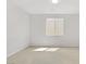 A well-lit, blank canvas of a room, bathed in neutral tones, ready for imagination and design at 8564 Scalpay St, Las Vegas, NV 89166