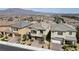 Street view showcasing multiple homes with well-maintained landscaping and attractive curb appeal in a desirable neighborhood at 8564 Scalpay St, Las Vegas, NV 89166