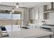 Stylish kitchen with quartz countertops, stainless steel appliances and pendant lighting at 8564 Scalpay St, Las Vegas, NV 89166