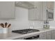Close-up of a kitchen cooktop and counter with stainless steel appliances at 8564 Scalpay St, Las Vegas, NV 89166