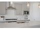 Close-up of a kitchen island featuring a modern sink and stainless steel appliances at 8564 Scalpay St, Las Vegas, NV 89166