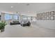 Spacious living room with plush sectional sofa, ceiling fan, and sliding doors to outdoor area at 8564 Scalpay St, Las Vegas, NV 89166