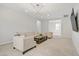 Bright upstairs loft features a modern light fixture, comfortable seating, and entertainment area at 8564 Scalpay St, Las Vegas, NV 89166
