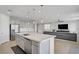 Open-concept kitchen and living area featuring modern finishes and ample space at 8564 Scalpay St, Las Vegas, NV 89166