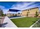 Community playground with an adjacent grassy area and walking path, perfect for Gathering recreation at 8564 Scalpay St, Las Vegas, NV 89166