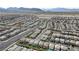 Aerial shot capturing an organized residential area with streets, houses, and sparse desert landscaping at 8564 Scalpay St, Las Vegas, NV 89166
