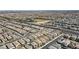 Aerial view showcases a vast residential area with orderly streets and numerous well-maintained homes at 8564 Scalpay St, Las Vegas, NV 89166