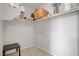 A walk-in closet with built-in shelves and hanging rods for ample storage at 8564 Scalpay St, Las Vegas, NV 89166