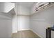 Walk-in closet featuring shelving and neutral carpeting, offering ample storage space at 8564 Scalpay St, Las Vegas, NV 89166