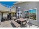Outdoor dining area with large table, offering plenty of space for gatherings at 8725 Hawk Canyon St, Henderson, NV 89074
