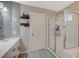 Modern bathroom design with spacious vanity, sleek fixtures, and glass-enclosed shower at 8725 Hawk Canyon St, Henderson, NV 89074