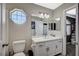 Bathroom featuring a framed vanity mirror with drawers, offering plenty of storage space at 8725 Hawk Canyon St, Henderson, NV 89074