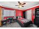 Bright bedroom featuring a bed, desk, and shelving, great for study and relaxation at 8725 Hawk Canyon St, Henderson, NV 89074