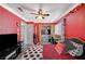 Red themed bedroom featuring a ceiling fan, window, and closet, creating a cozy retreat at 8725 Hawk Canyon St, Henderson, NV 89074