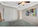 This is a bedroom with a grey color scheme, complete with a camera wall art piece at 8725 Hawk Canyon St, Henderson, NV 89074