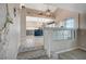 Open-concept entryway with decorative stairs leading to the open kitchen at 8725 Hawk Canyon St, Henderson, NV 89074