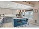 Bright, modern kitchen features a center island with seating and stainless steel appliances at 8725 Hawk Canyon St, Henderson, NV 89074