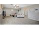 Spacious living room with tiled floors, stylish furniture, and a decorative fireplace at 8725 Hawk Canyon St, Henderson, NV 89074