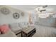 Cozy living room with neutral colors, modern furnishings, and tiled floors at 8725 Hawk Canyon St, Henderson, NV 89074