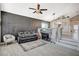 Contemporary living room with a sleek sofa, stylish decor, and open layout at 8725 Hawk Canyon St, Henderson, NV 89074