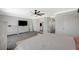 Bright main bedroom featuring light gray walls, multiple closets and ensuite bathroom at 8725 Hawk Canyon St, Henderson, NV 89074