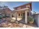 View of the backyard and covered patio, offering a serene outdoor space for relaxation and entertaining at 8771 Martinique Bay Ln, Las Vegas, NV 89147