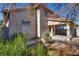 Backyard featuring a covered patio and natural desert landscaping at 8771 Martinique Bay Ln, Las Vegas, NV 89147