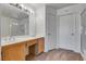 Bathroom featuring a double vanity sink, shower, and carpeted floor at 8771 Martinique Bay Ln, Las Vegas, NV 89147