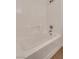 Bright white tiled bathtub with shower and neutral flooring at 8771 Martinique Bay Ln, Las Vegas, NV 89147