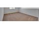 Bright bedroom features neutral carpeting and a window for natural light at 8771 Martinique Bay Ln, Las Vegas, NV 89147