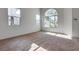Bright bedroom with carpeting, natural light from multiple windows, and neutral wall colors at 8771 Martinique Bay Ln, Las Vegas, NV 89147