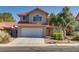 Charming two-story home with a tile roof, manicured lawn, and a two-car garage at 8771 Martinique Bay Ln, Las Vegas, NV 89147