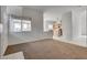 Bright living room features an open floorplan to the kitchen, with a window at 8771 Martinique Bay Ln, Las Vegas, NV 89147