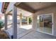 Covered patio offering concrete floors, pillars, and a ceiling fan with a view to the kitchen at 8771 Martinique Bay Ln, Las Vegas, NV 89147