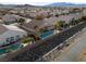 An elevated shot displays residences, each featuring a refreshing pool and verdant palm trees at 8894 Don Horton Ave, Las Vegas, NV 89178