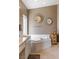 Bathroom featuring a corner tub and a small, well decorated furniture set at 8894 Don Horton Ave, Las Vegas, NV 89178