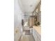Bathroom featuring a shower with glass doors, toilet, white vanity and ceramic tile flooring at 8894 Don Horton Ave, Las Vegas, NV 89178