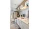Bathroom featuring double sinks and a shower with glass door at 8894 Don Horton Ave, Las Vegas, NV 89178