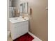 Bathroom featuring white vanity with sink, mirrored medicine cabinet, and red accent rug at 8894 Don Horton Ave, Las Vegas, NV 89178
